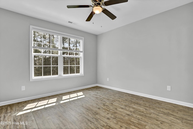 141 Beacon Woods Dr, Holly Ridge, NC 28445 - spare room with wood finished floors, baseboards, and a ceiling fan