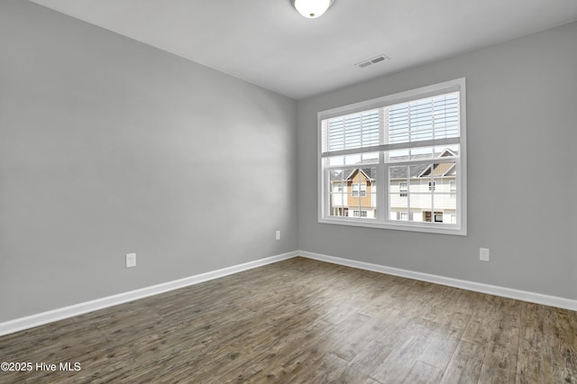 141 Beacon Woods Dr, Holly Ridge, NC 28445 - empty room featuring dark wood-style flooring and baseboards