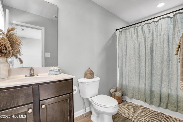 141 Beacon Woods Dr, Holly Ridge, NC 28445 - full bathroom with vanity, toilet, wood finished floors, and shower / tub combo