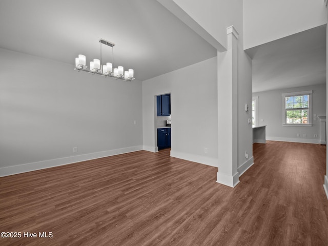 153 Ballantine Grove Ln, Newport, NC 28570 - unfurnished dining area featuring a chandelier, dark wood-type flooring, and baseboards