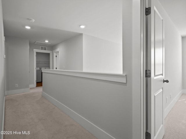 153 Ballantine Grove Ln, Newport, NC 28570 - hall featuring light colored carpet, independent washer and dryer, baseboards, and recessed lighting