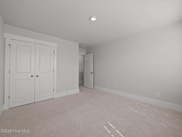 153 Ballantine Grove Ln, Newport, NC 28570 - unfurnished bedroom featuring carpet, baseboards, and a closet