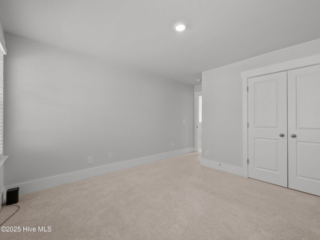 153 Ballantine Grove Ln, Newport, NC 28570 - unfurnished bedroom with carpet flooring, baseboards, and a closet