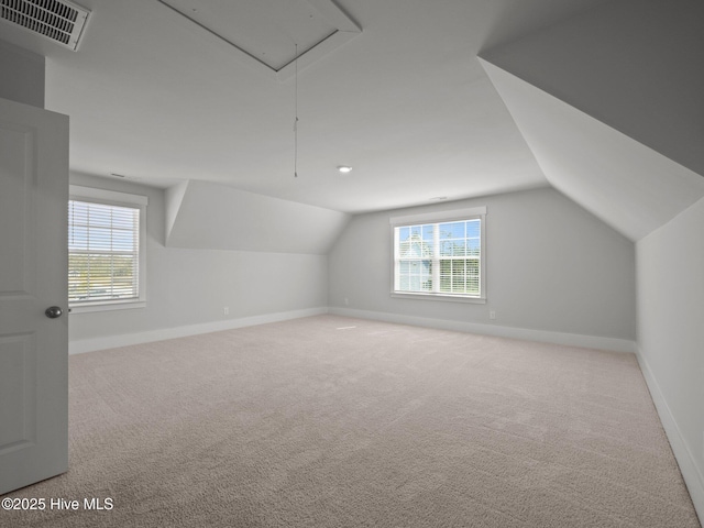 153 Ballantine Grove Ln, Newport, NC 28570 - bonus room featuring attic access, lofted ceiling, carpet, and baseboards