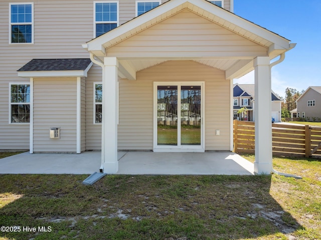 153 Ballantine Grove Ln, Newport, NC 28570 - rear view of property featuring fence, a patio, and a shingled roof