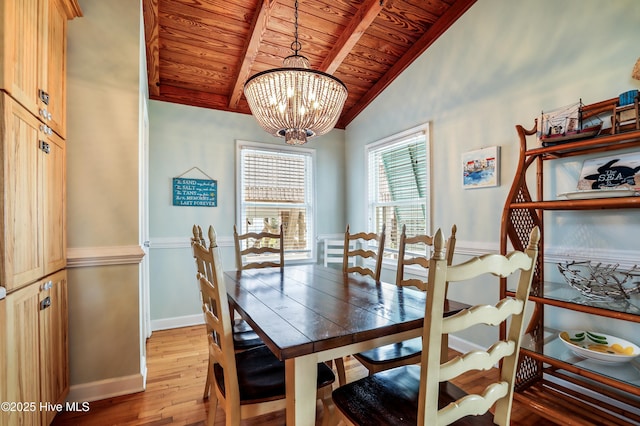 living area featuring wood finished floors, visible vents, a ceiling fan, and high vaulted ceiling
