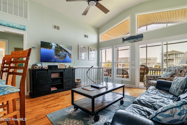 living room with visible vents, a ceiling fan, french doors, light tile patterned flooring, and a textured ceiling
