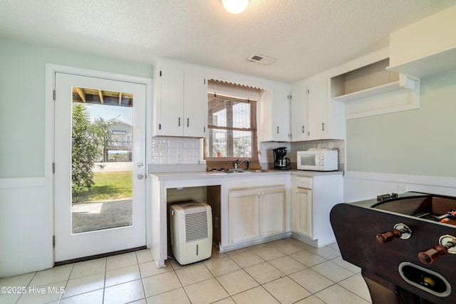 full bath with tile patterned flooring, vanity, and a shower with curtain