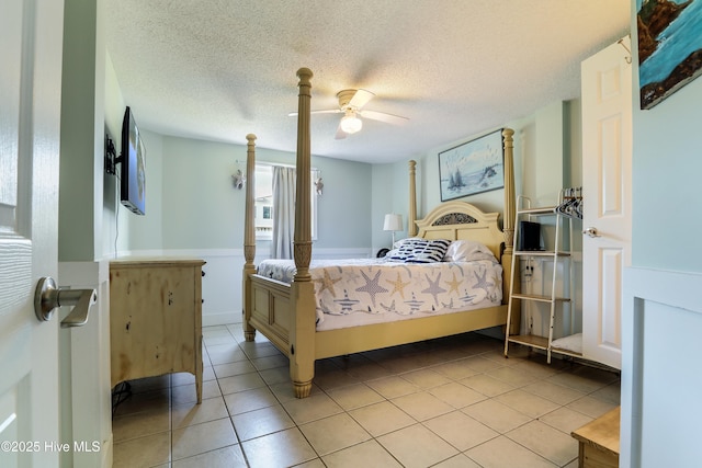 bedroom with a ceiling fan, vaulted ceiling with beams, light wood-style flooring, wooden ceiling, and baseboards