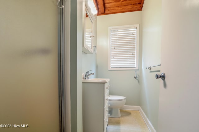 bedroom with baseboards, wood finished floors, and visible vents