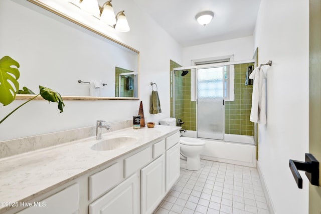 full bath with tile patterned flooring, vanity, toilet, and bath / shower combo with glass door