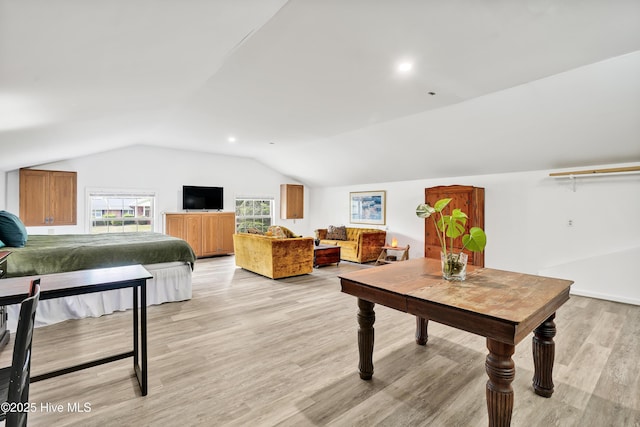 playroom featuring lofted ceiling, light wood finished floors, and recessed lighting