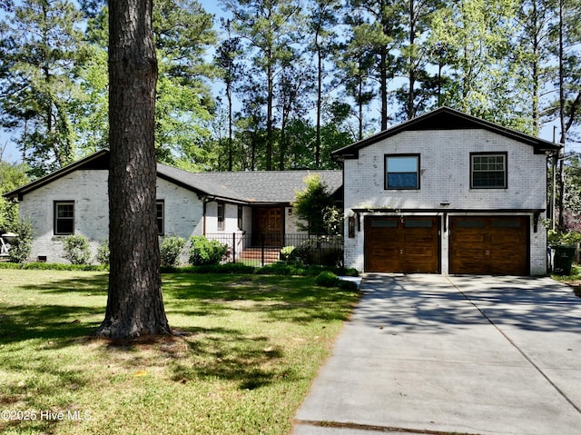 view of front of home with brick siding, an attached garage, and concrete driveway