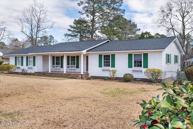 ranch-style house with a front lawn, crawl space, roof with shingles, and covered porch