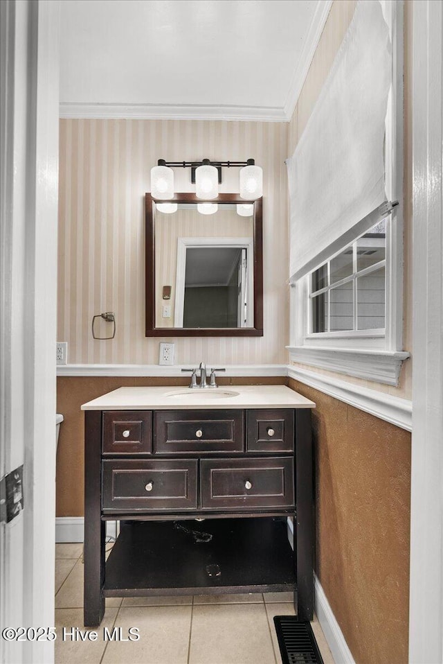bathroom with tile patterned floors, visible vents, wallpapered walls, vanity, and ornamental molding