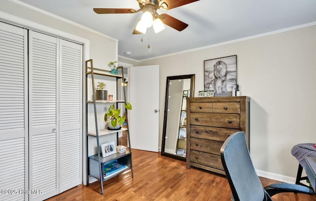 office area with wood finished floors, crown molding, and ceiling fan