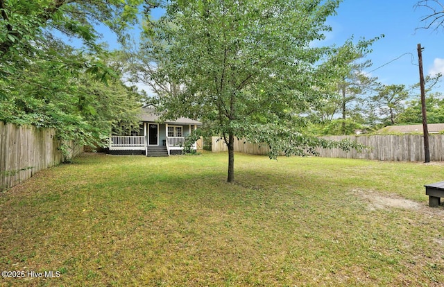 view of yard featuring a wooden deck