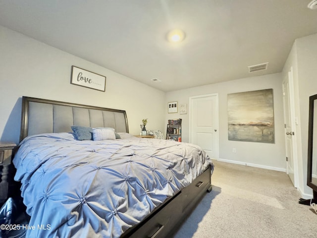 carpeted bedroom with visible vents and baseboards