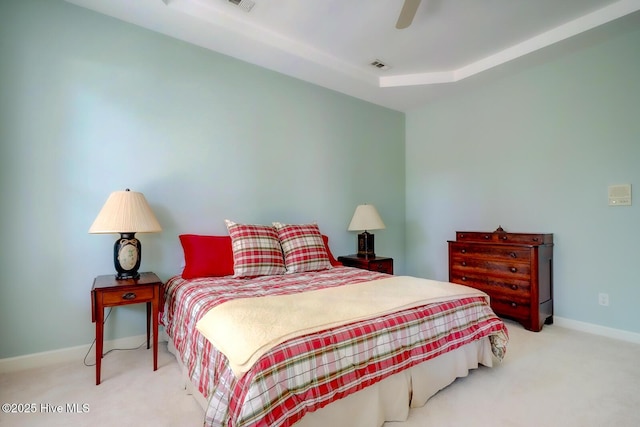 carpeted bedroom with baseboards and a ceiling fan