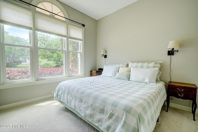 carpeted bedroom with baseboards