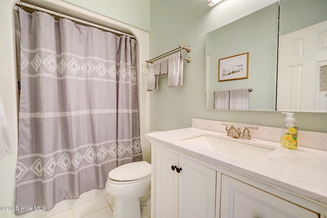 bathroom featuring toilet, vanity, tile patterned floors, and a shower with shower curtain