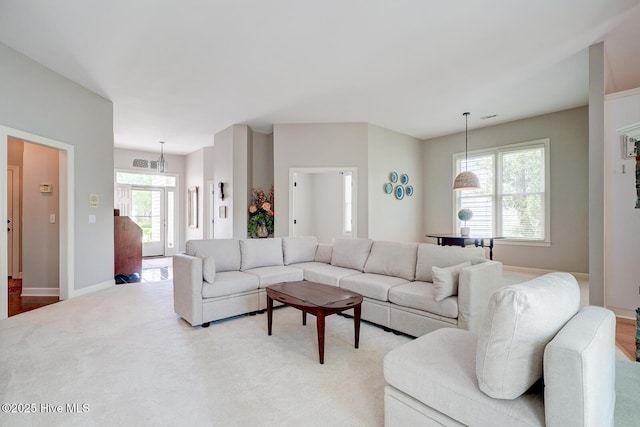 living room with carpet floors and baseboards