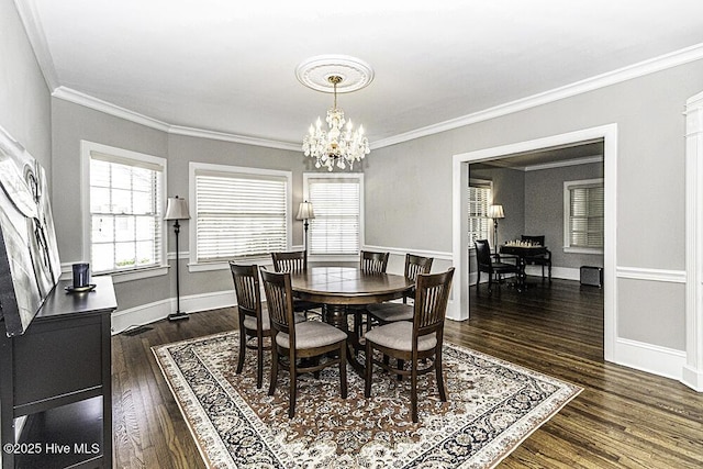 300 Moye Ave NW, Wilson, NC 27893 - dining room featuring a chandelier, dark wood-style flooring, and crown molding