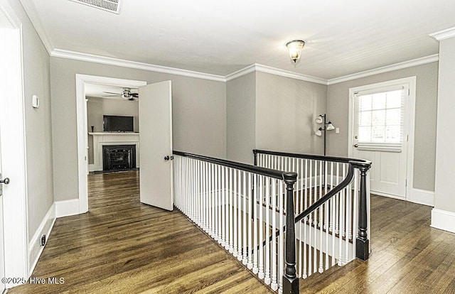 300 Moye Ave NW, Wilson, NC 27893 - corridor featuring an upstairs landing, wood finished floors, and ornamental molding