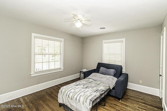 300 Moye Ave NW, Wilson, NC 27893 - bedroom with dark wood finished floors and a ceiling fan