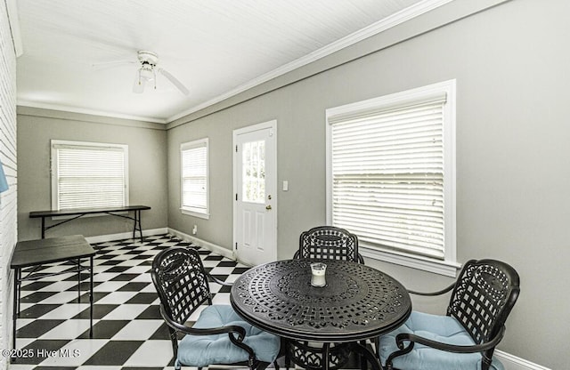 foyer entrance with ornamental molding, baseboards, ceiling fan, and tile patterned floors