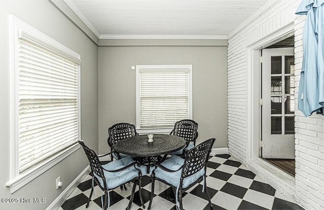 300 Moye Ave NW, Wilson, NC 27893 - dining room featuring tile patterned floors, ornamental molding, and plenty of natural light