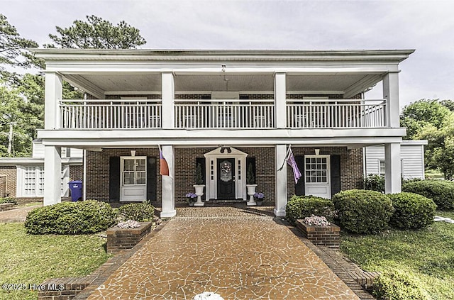 300 Moye Ave NW, Wilson, NC 27893 - view of front facade with a balcony and brick siding