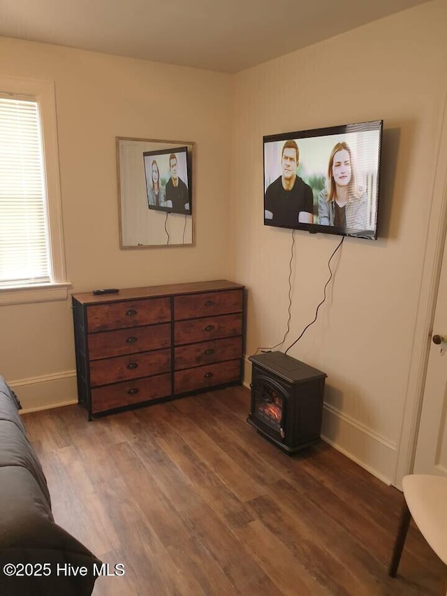 300 Moye Ave NW, Wilson, NC 27893 - living area with a wood stove and wood finished floors