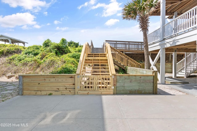505 Caswell Beach Rd, Caswell Beach, NC 28465 - view of patio featuring stairs, a gate, and fence