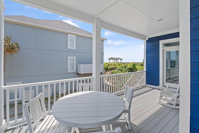 505 Caswell Beach Rd, Caswell Beach, NC 28465 - view of wooden deck