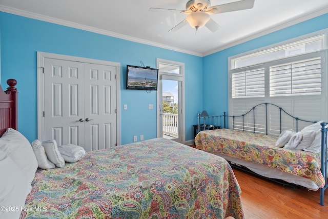 505 Caswell Beach Rd, Caswell Beach, NC 28465 - bedroom with access to outside, ceiling fan, wood finished floors, ornamental molding, and a closet