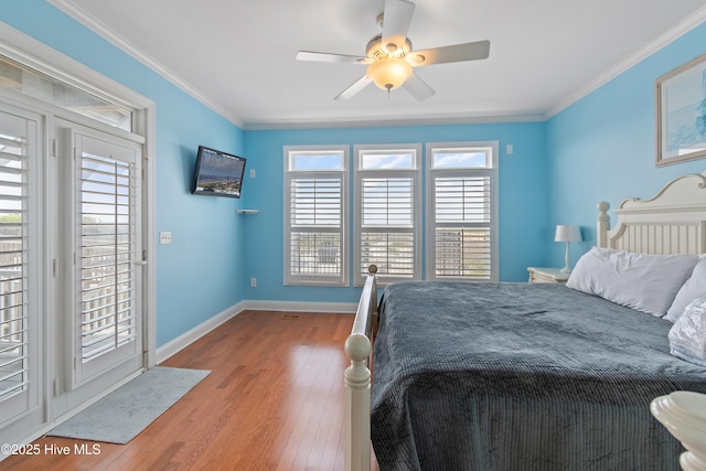 505 Caswell Beach Rd, Caswell Beach, NC 28465 - bedroom featuring baseboards, ornamental molding, a ceiling fan, and wood finished floors