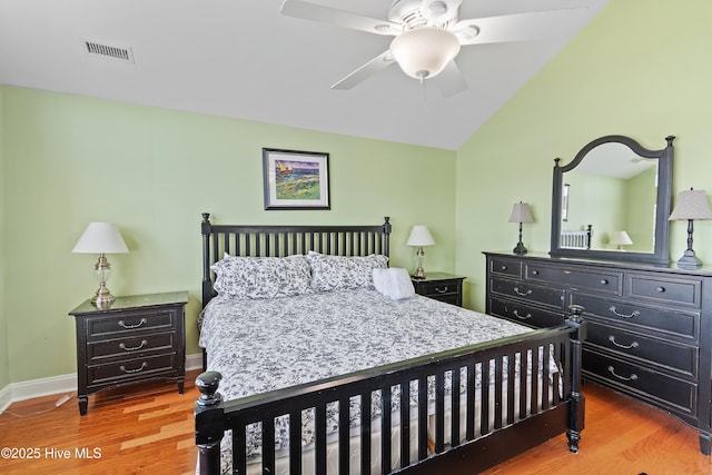 505 Caswell Beach Rd, Caswell Beach, NC 28465 - bedroom with visible vents, a ceiling fan, wood finished floors, and vaulted ceiling