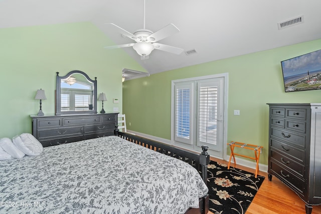 505 Caswell Beach Rd, Caswell Beach, NC 28465 - bedroom featuring a ceiling fan, baseboards, visible vents, and wood finished floors