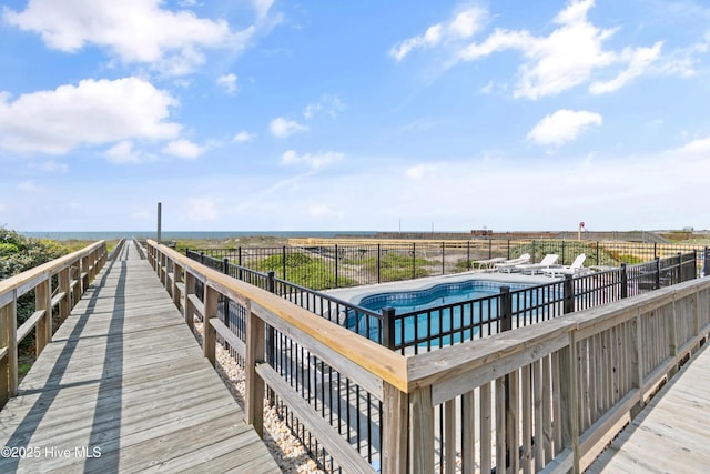 505 Caswell Beach Rd, Caswell Beach, NC 28465 - deck with a fenced in pool and fence