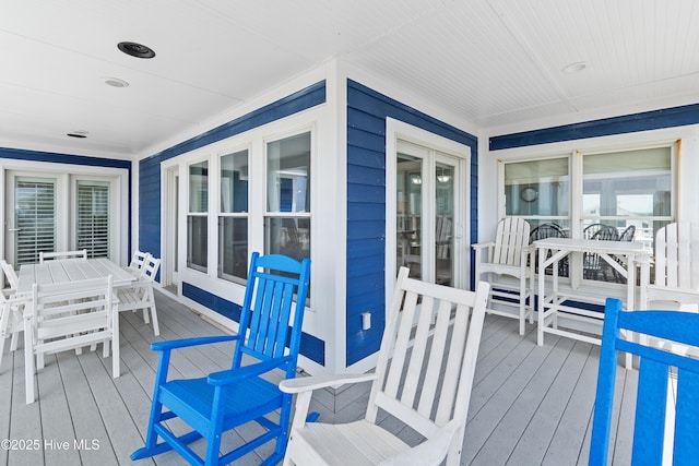 505 Caswell Beach Rd, Caswell Beach, NC 28465 - deck with outdoor dining space and covered porch