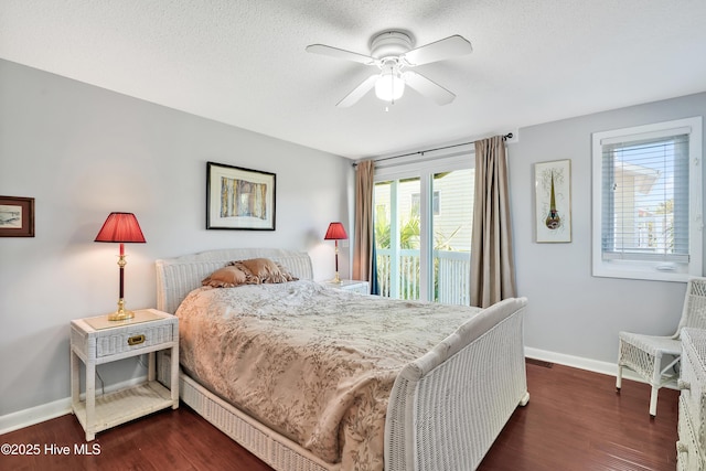 bedroom with baseboards, access to outside, and dark wood-type flooring
