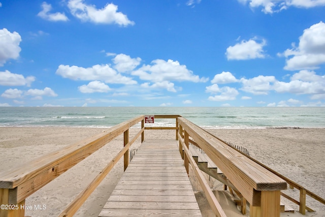 view of property's community featuring view of water and beach