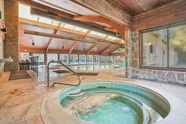 view of swimming pool featuring an in-ground hot tub