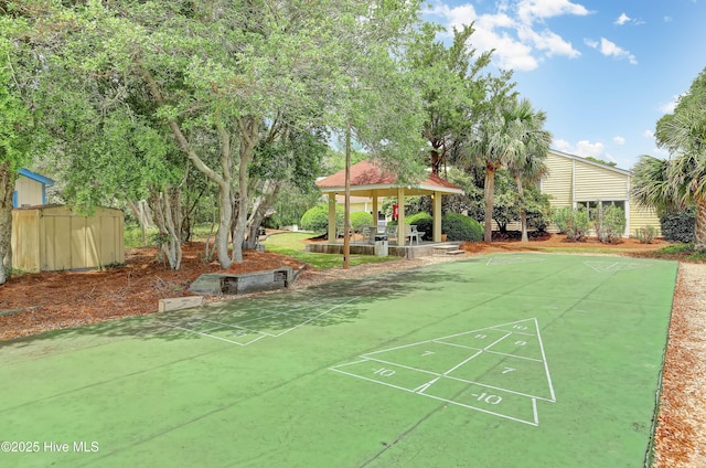 view of property's community with a gazebo and shuffleboard