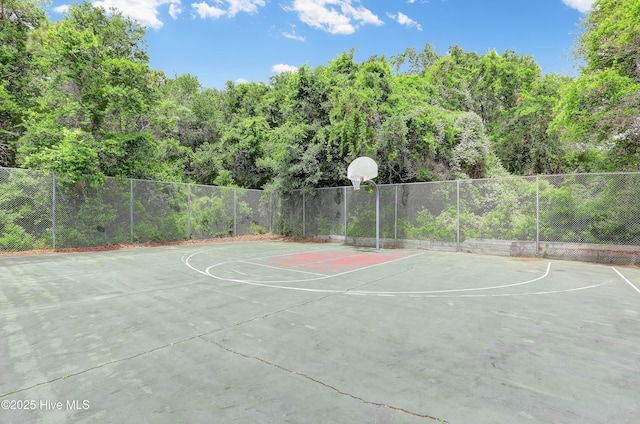 view of sport court featuring community basketball court and fence