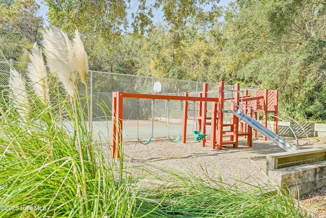 community jungle gym featuring fence