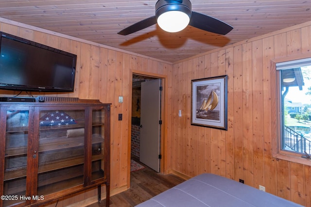 105 Tucker Ct, West End, NC 27376 - bedroom with wood ceiling, wood walls, and wood finished floors