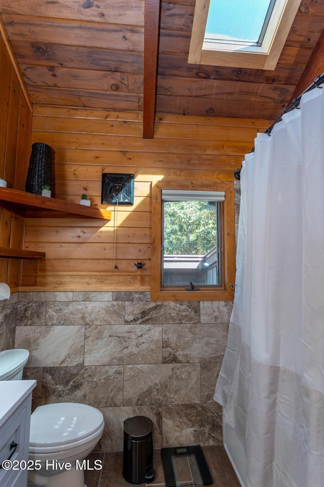 105 Tucker Ct, West End, NC 27376 - full bath with a skylight, toilet, wood ceiling with exposed beams, vanity, and a shower with shower curtain