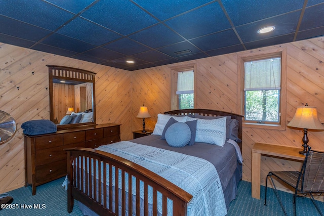 105 Tucker Ct, West End, NC 27376 - bedroom featuring carpet flooring, wood walls, and recessed lighting